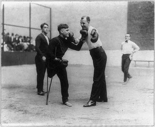 Sam Luzofsky (one leg) and Lon Young (one arm) boxing