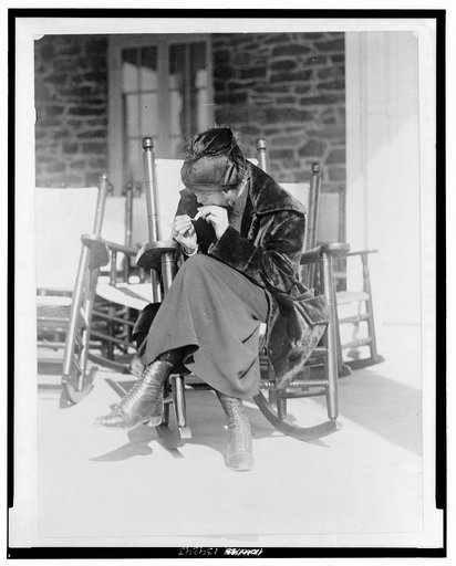 Miss Sarah Anderson, a Washington suffragist who advocates equal smoking rights for men and women in public places, snaped [sic] as she "puffed" a cigarette at the Chevy Chase Club, Washington's most exclusive country club