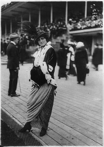 Women's fashions: ermine trim coat with plumed hat