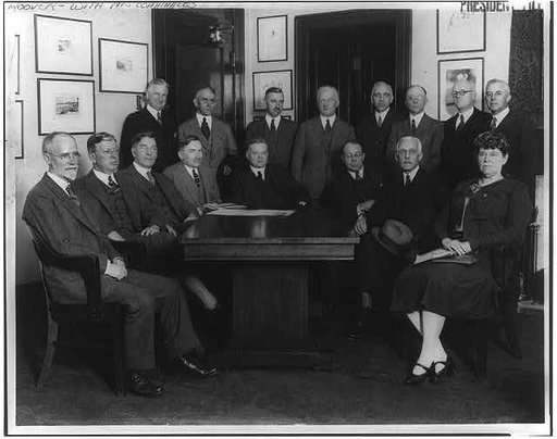 4 members of Pres. Coolidge's cabinet (Hoover, Davis, Wilbus & Mellon), American Red Cross members, and government agency representatives gathered to discuss relief work for sufferers in the Mississippi River Valley Flood