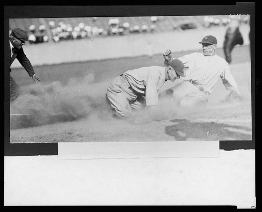 Joe Harris, of the Washington National, sliding safely into 3rd base during a baseball game