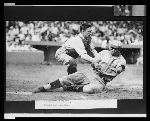 Bing Miller, of the Philadelphia Athletics, tagged out at home plate by Washington Nationals catcher "Muddy" Ruel during baseball game