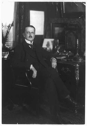 Count Brockdorff-Rantzau, full-length portrait, seated at desk, facing right