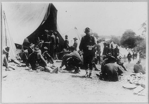 News photos of N.Y. National Guard units preparing for active duty on Mexican border, May-Nov. 1916: General view of soldiers with mess gear