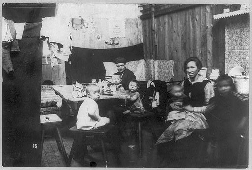 Family in crowded living quarters in Essen, Germany, during French occupation