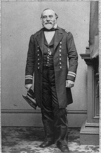Henry Beauchamp Nones, full length portrait, standing, holding hat, facing slightly left - in uniform. Naval engineer