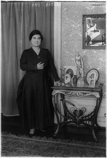 Amy Castles, full length portrait, standing, facing right. Australian singer