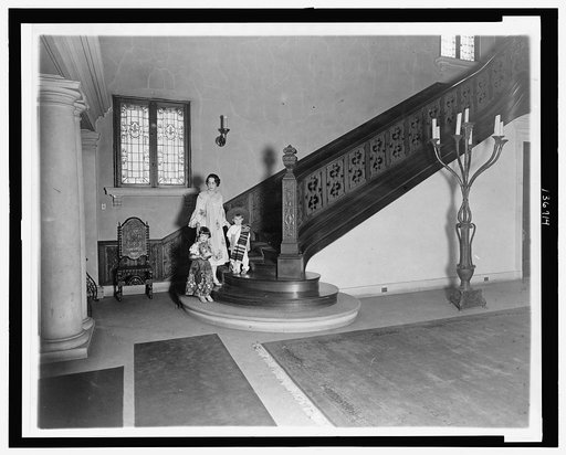 Senora Don Manuel Terrez, wife of the Mexican Ambassador, and her two children posed by the staircase at the Mexican Embassy