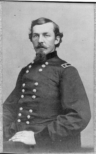 Nelson Appleton Miles, 1839-1925, half length, seated, facing front, wearing brevet Maj. Gen. uniform