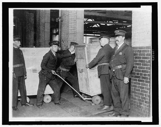 Transporting the new small sized currency. Armoured trucks are used in removing the new money from the Bureau to the Treasury Dept.