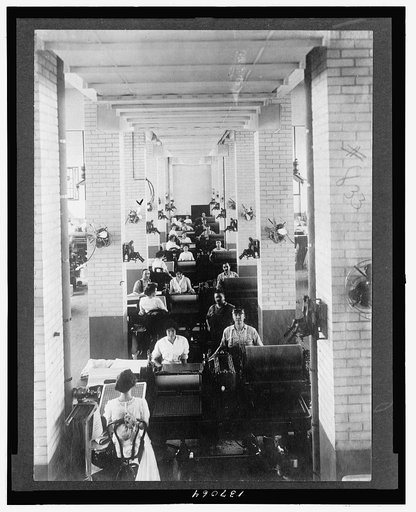 Men and women operating machinery