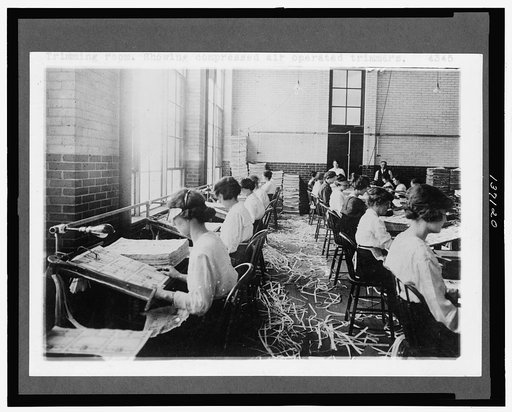 Trimming room. Showing compressed air operated trimmers