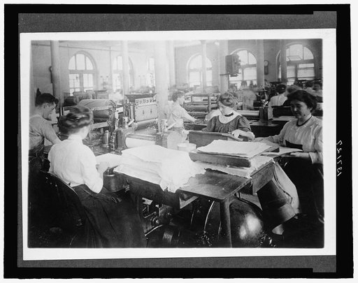 Men and women seated at workstations