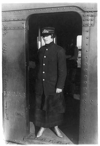 Women subway workers, N.Y.C., 1917: guard standing in subway doorway