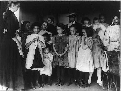 Children awaiting health clinic doctor on recreation pier, N.Y.C.