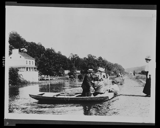 Group disembarking from a rowboat along the Chesapeake and Ohio Canal near the Abner Cloud House at Fletcher's Cove, Georgetown, D.C.