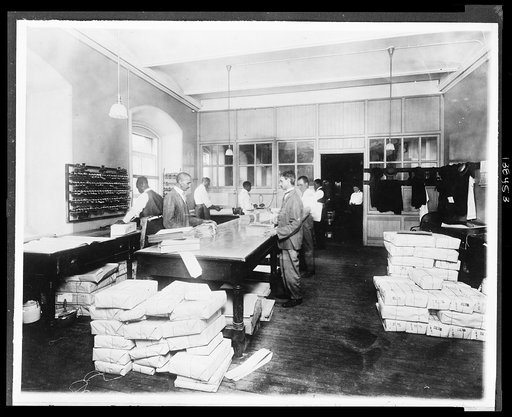 Treasury. Packing internal revenue stamps for shipment Stamps to the value of $1,000,000 packed daily.