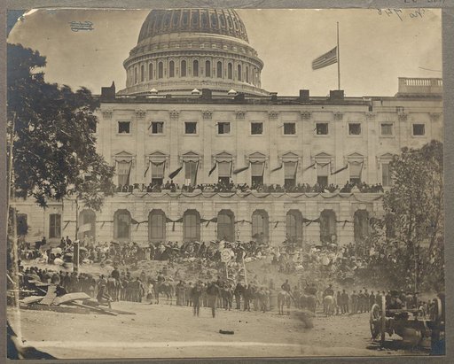 Washington, D.C. Spectators at side of the Capitol, which is hung with crepe and has flag at half-mast during the "grand review" of the Union Army