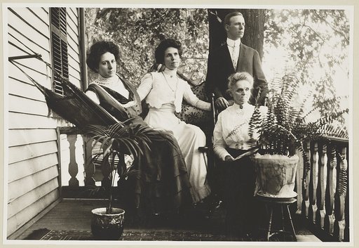 Three women and a man posed on a porch in Vienna, Va.