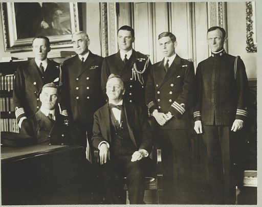 Secretary of Navy Josephus Daniels (center) seated with Admiral [Trevylyan] Napier, R.N.; standing left to right: Capt. Blake of Naval Attache British Embassy, Admiral Long of U.S.N., Lt. Curzon-Howe, R.N., Com. Bevan, R.N., Com. Foote, U.S.N.