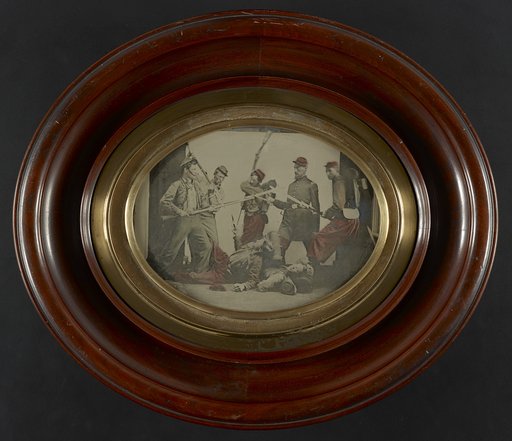 Seven unidentified soldiers in Union uniforms reenacting a battle scene
