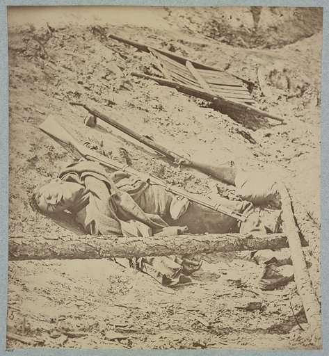 Dead Confederate soldier in trenches of Fort Mahone in front of Petersburg, Va., April 3, 1865