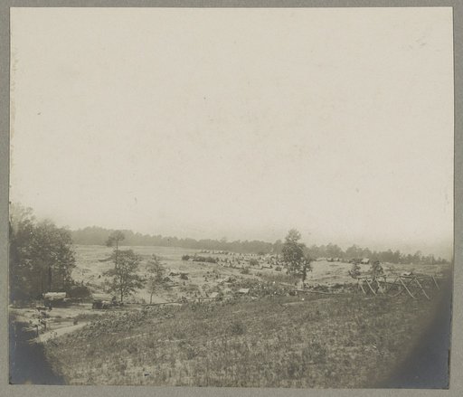Aerial view of a camp in the distance