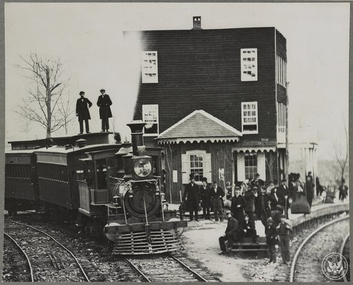 Hanover Junction Pennsylvania, 1863, railroad station. Detail of engine in yard and waiting crowd