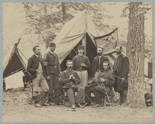 Group of officers in front of tents