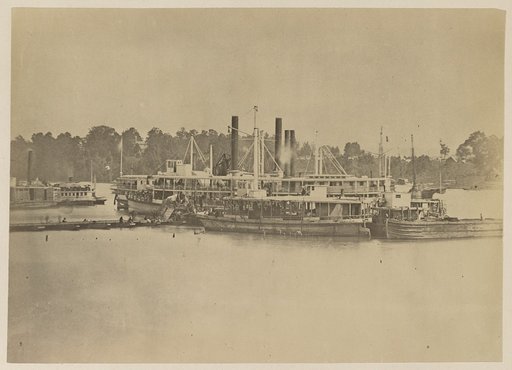 Cluster of supply boats at a pontoon bridge