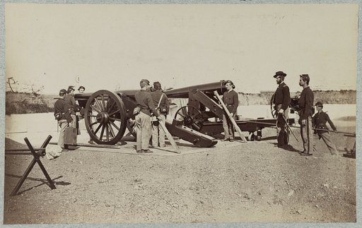 Union soldiers and three mounted cannons inside a fort