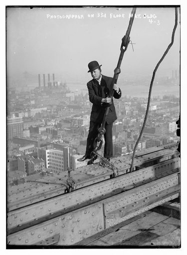 Photographer on 33rd floor Met. Bldg.