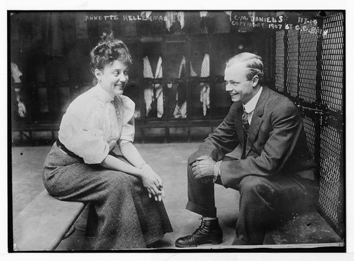 Annette Kellerman and C.M. Daniels [i.e. Charles M. Daniels], seated, talking