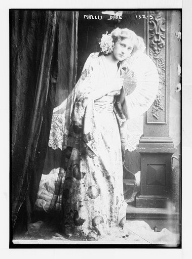 Phyllis Dare, standing