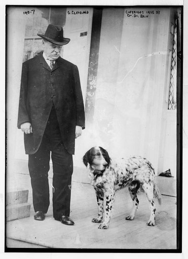 G. Cleveland, standing with dog