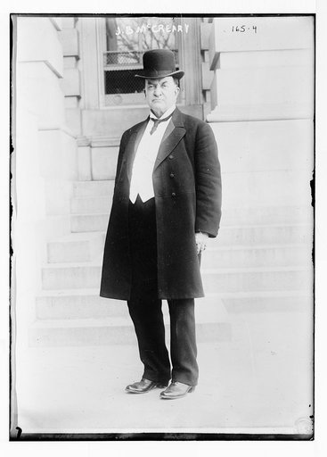J.B. McCreary, standing