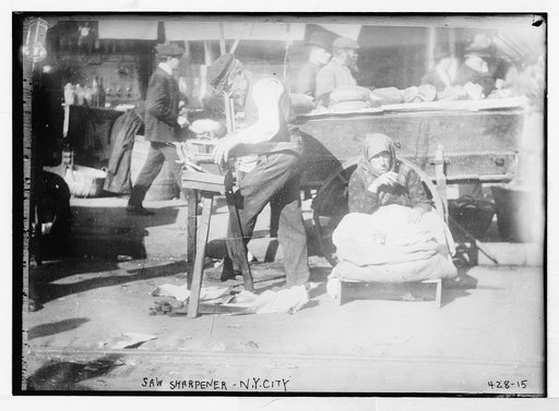 Man sharpening a saw, New York