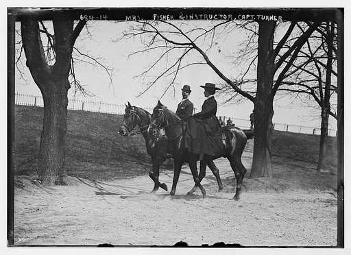 Mrs. Fisher and Capt. Turner, her instructor, horseback riding in park