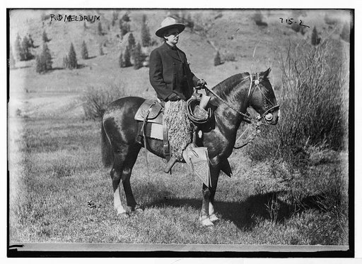 R.D. Meldrum, in cowboy outfit, on quarter horse
