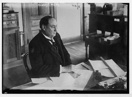 Harvey E. Wiley, seated at desk