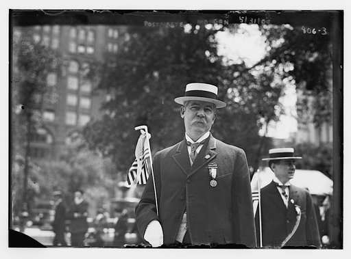 Postmaster Morgan, holding flag, Jersey City, N.J.