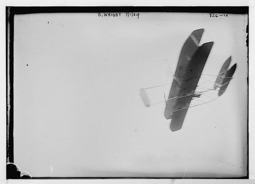 O. Wright and aeroplane, in flight