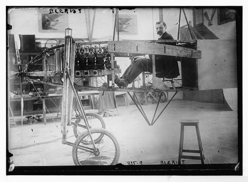 Bleriot, in workshop, in his flying machine