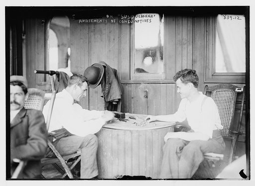 Consumptives playing dominoes aboard "Susquehanna", ferryboat used for tuberculosis camp