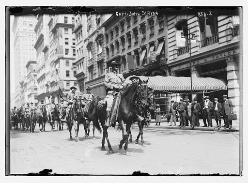 Capt. John O'Ryan, on horse-back, leading 1st Battery to war game, New York