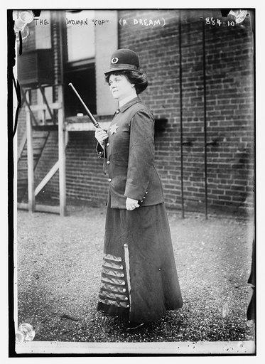 A dream - the woman "cop" holding a bobby stick