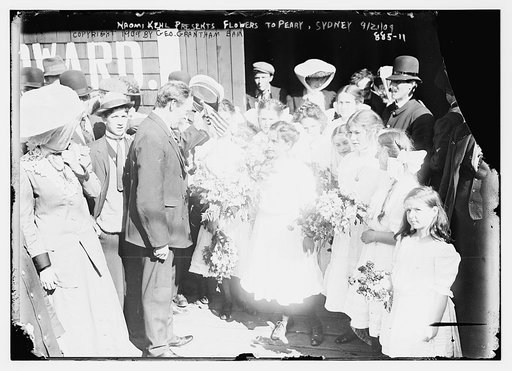 Naomi Kehl and other girls present flowers to Peary, Sydney