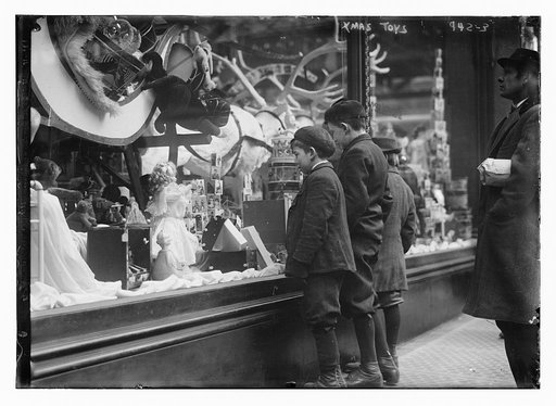 Children looking at Xmas toys in shop window
