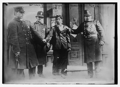 Battered striker with policemen, Philadelphia