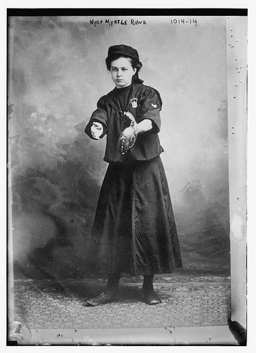 Miss Myrtle Rowe holding a baseball mitt